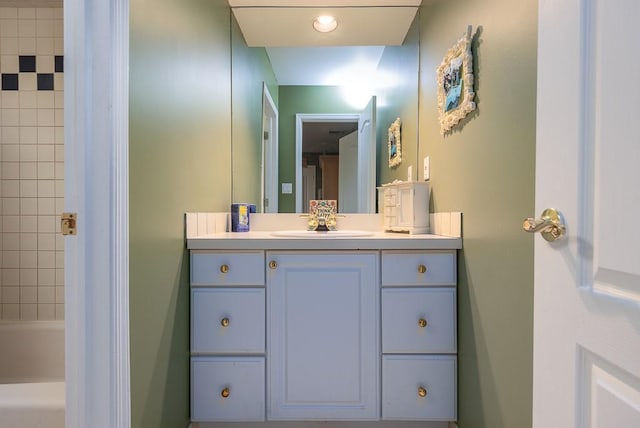 bathroom with bathtub / shower combination and vanity