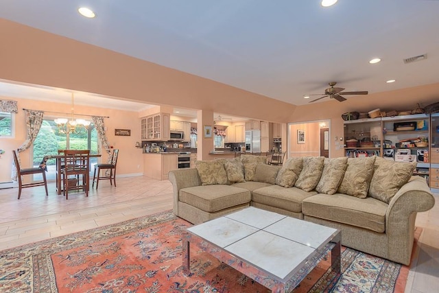 living room with recessed lighting, visible vents, and ceiling fan with notable chandelier