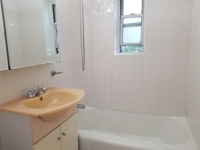 111-16 66th Ave Unit 3C, Forest Hills, NY 11375 - bathroom with tile walls, backsplash, and vanity