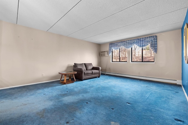 unfurnished room featuring carpet flooring, a textured ceiling, a baseboard heating unit, and baseboards