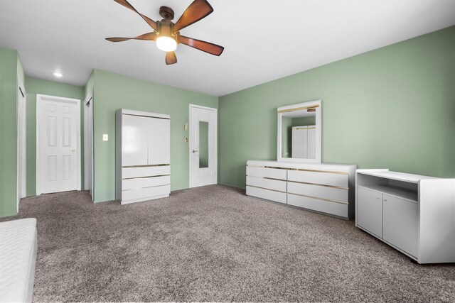 unfurnished bedroom with a ceiling fan and carpet floors