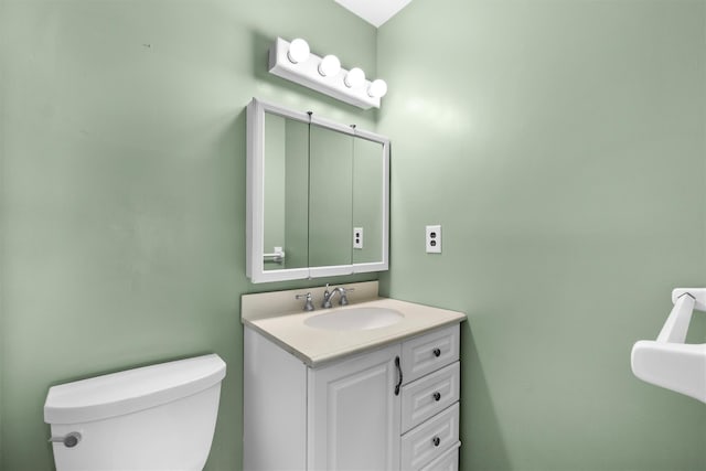 bathroom with toilet and vanity