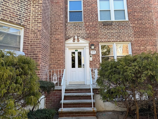 entrance to property with brick siding