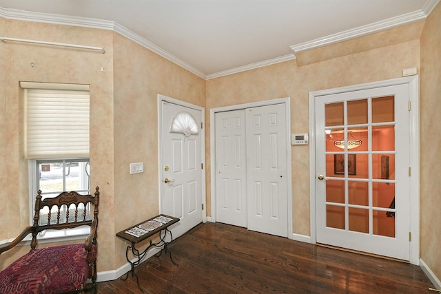 entrance foyer featuring ornamental molding, baseboards, and wood finished floors