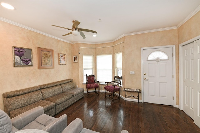 living room featuring a ceiling fan, baseboards, hardwood / wood-style floors, and ornamental molding