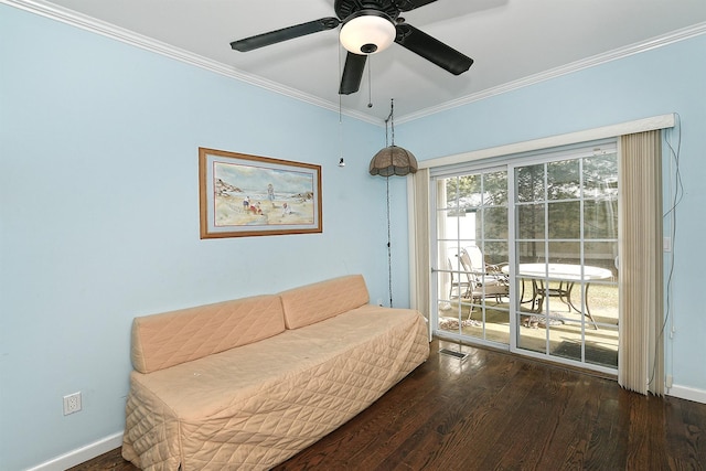 sitting room with crown molding, visible vents, a ceiling fan, wood finished floors, and baseboards