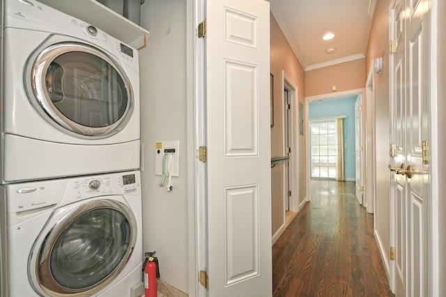 laundry area with recessed lighting, laundry area, stacked washer / dryer, wood finished floors, and ornamental molding