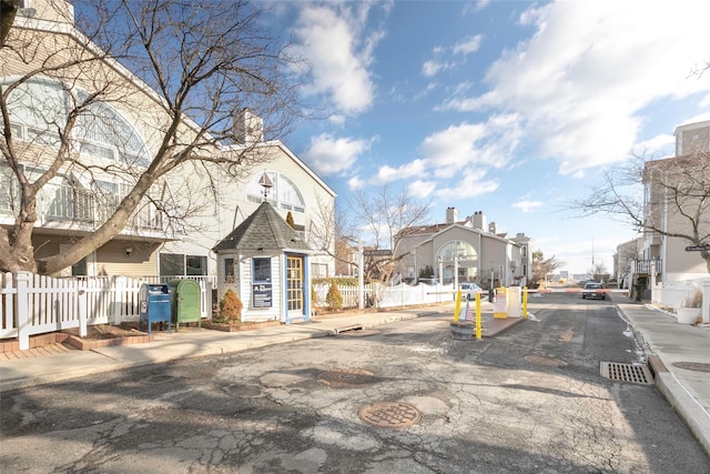 view of road with sidewalks and curbs