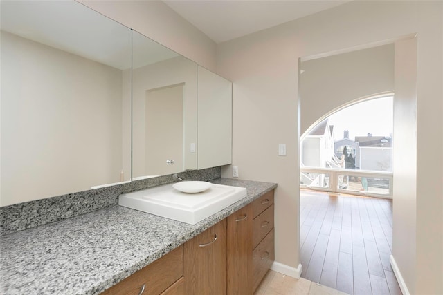 bathroom featuring vanity and baseboards