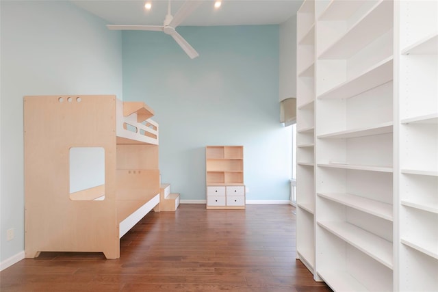 interior space with ceiling fan