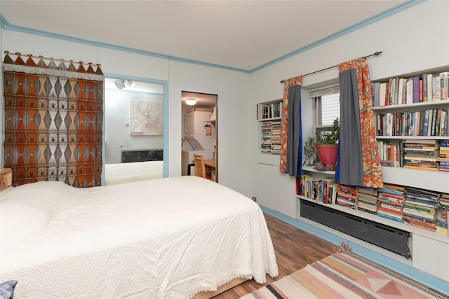 bedroom with wood finished floors