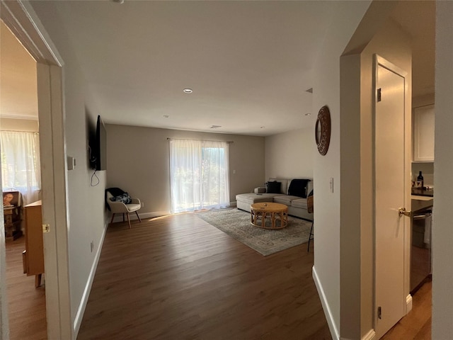 living room with light wood-style flooring and baseboards