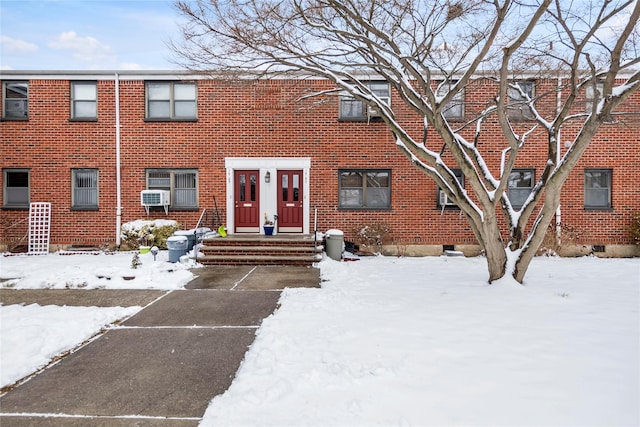 townhome / multi-family property featuring brick siding