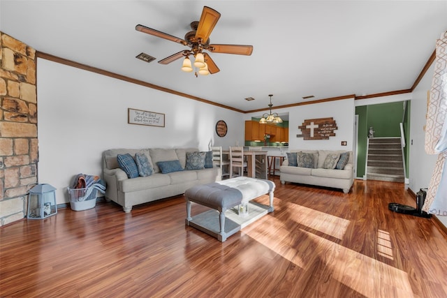 living area featuring stairs, ceiling fan, wood finished floors, and visible vents