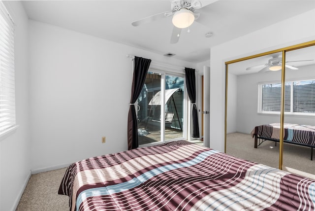 bedroom featuring light carpet, access to outside, a closet, and visible vents