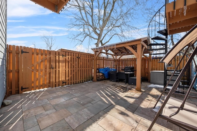 view of patio / terrace with a fenced backyard and stairs