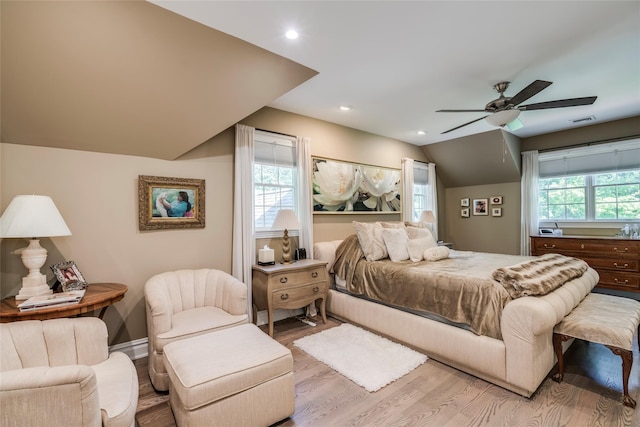 bedroom featuring recessed lighting, visible vents, light wood-style floors, vaulted ceiling, and ceiling fan