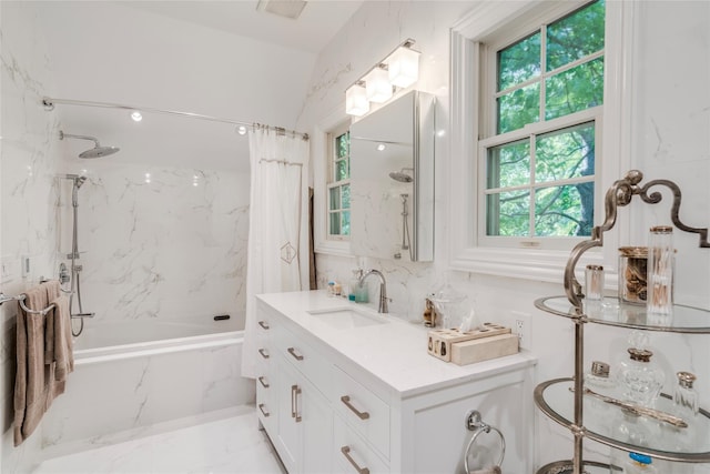 full bathroom with a combined bath / shower with marble appearance, visible vents, marble finish floor, and vanity