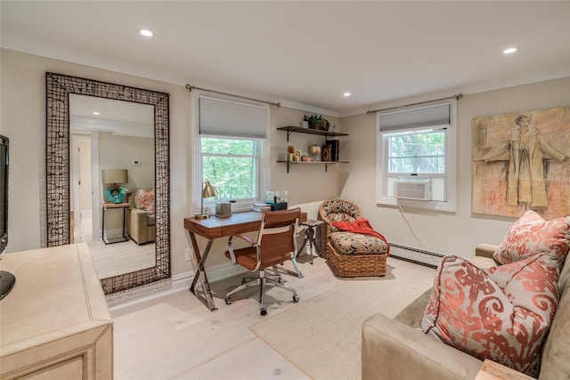 office area with a baseboard heating unit, recessed lighting, and a healthy amount of sunlight