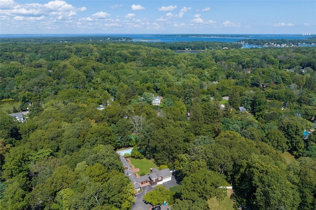 drone / aerial view with a wooded view