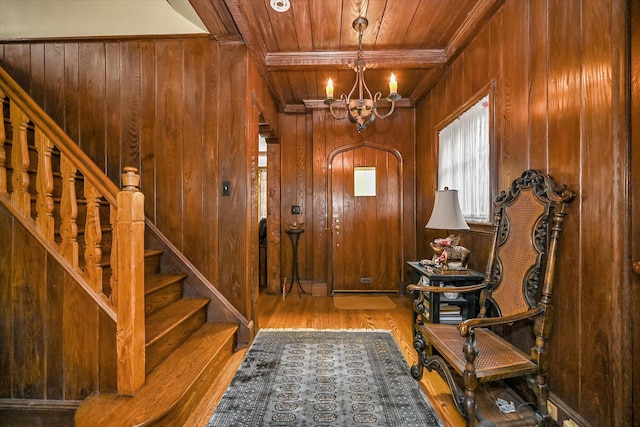 33-64 190th St, Flushing, NY 11358 - foyer entrance with wood ceiling, wood walls, a chandelier, wood finished floors, and stairs