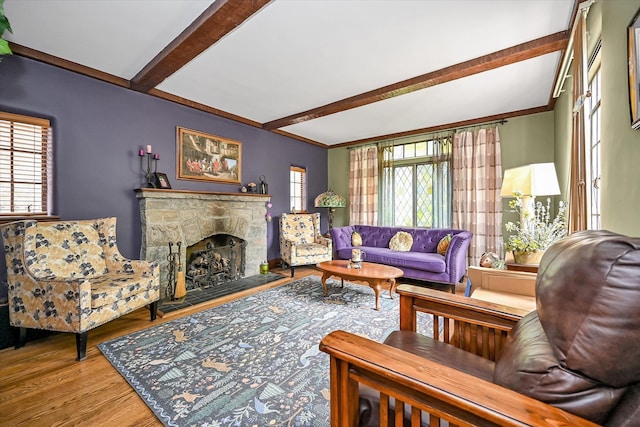 33-64 190th St, Flushing, NY 11358 - living room featuring wood finished floors, beamed ceiling, and a fireplace