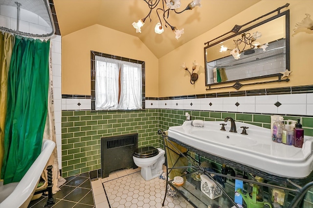 33-64 190th St, Flushing, NY 11358 - bathroom with toilet, a chandelier, tile walls, tile patterned flooring, and wainscoting