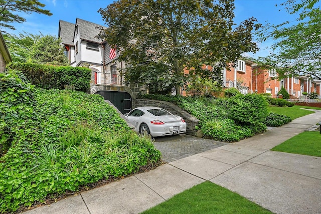 33-64 190th St, Flushing, NY 11358 - view of home's exterior featuring a residential view, driveway, and brick siding