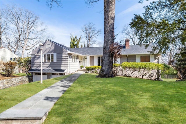 ranch-style house featuring a front yard, a garage, and a chimney