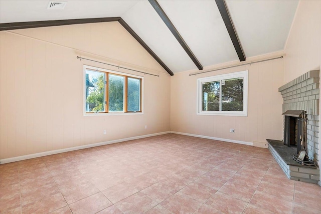 unfurnished living room featuring lofted ceiling with beams, visible vents, baseboards, and a fireplace