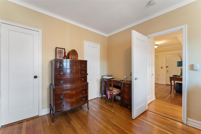 interior space featuring light wood-style floors and baseboards