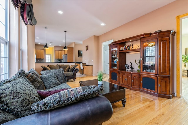 living room with recessed lighting and light wood finished floors