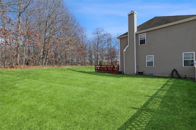 view of yard with a wooden deck