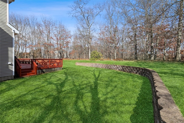 view of yard with a wooden deck