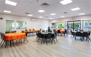 dining room with visible vents, a drop ceiling, and wood finished floors