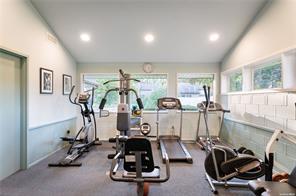 exercise room featuring vaulted ceiling and recessed lighting