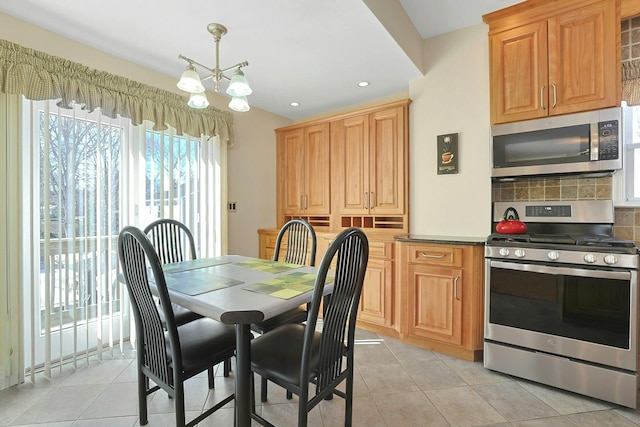 dining area featuring a chandelier, recessed lighting, and light tile patterned floors