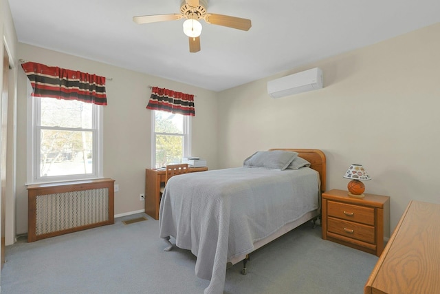 bedroom with light carpet, a ceiling fan, visible vents, a wall mounted AC, and radiator