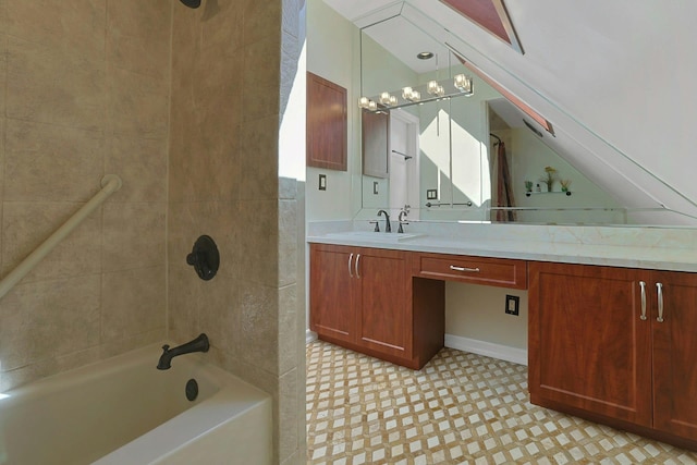 full bath with washtub / shower combination, vaulted ceiling, vanity, and tile patterned floors