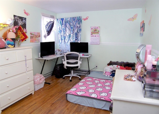 bedroom featuring wood finished floors