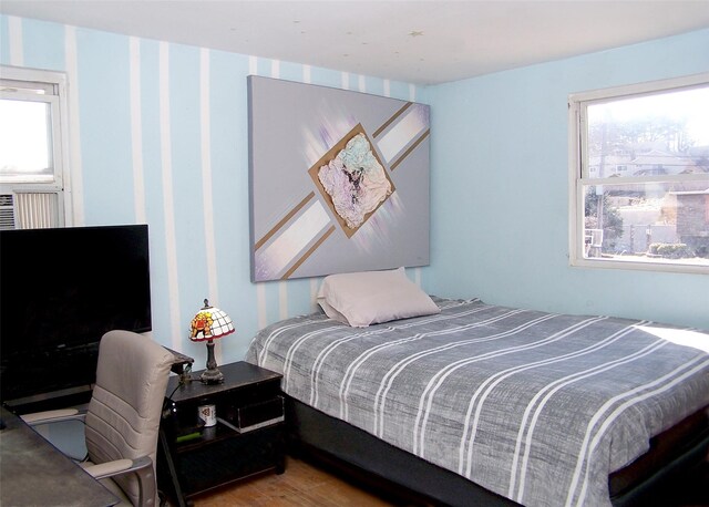 bedroom with wood finished floors