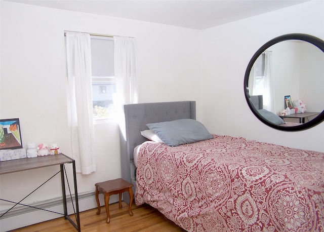 bedroom with wood finished floors