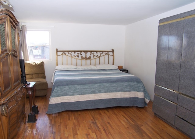 bedroom featuring wood finished floors