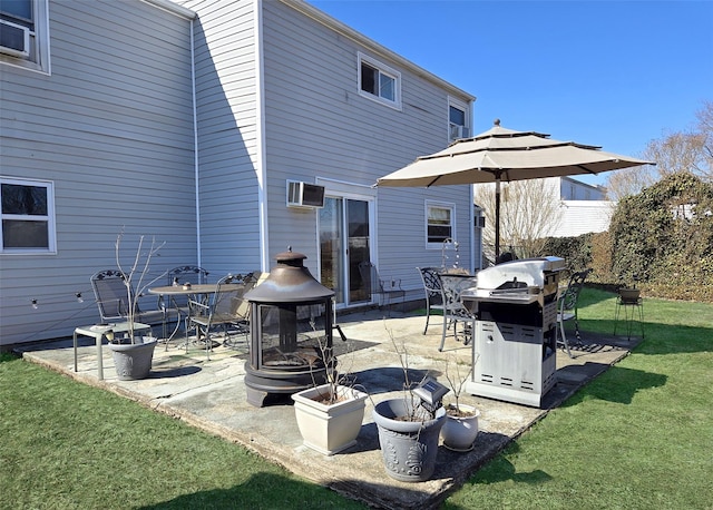 exterior space featuring a wall unit AC, a fire pit, and area for grilling