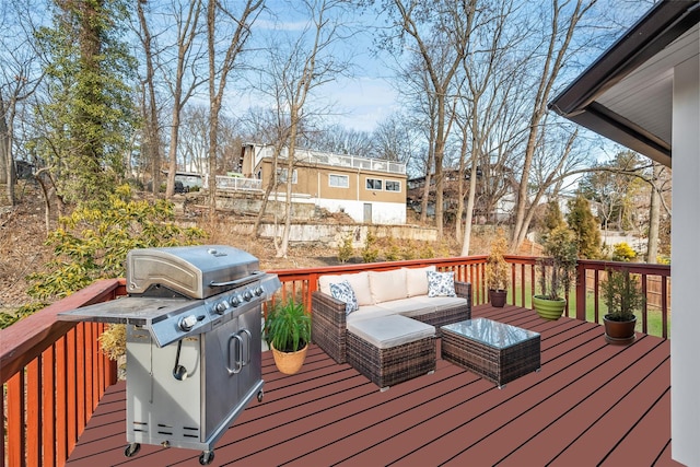 deck featuring a grill and an outdoor living space