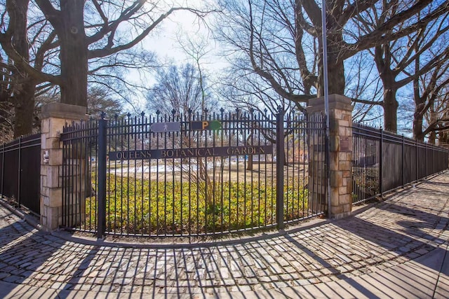 view of gate with fence