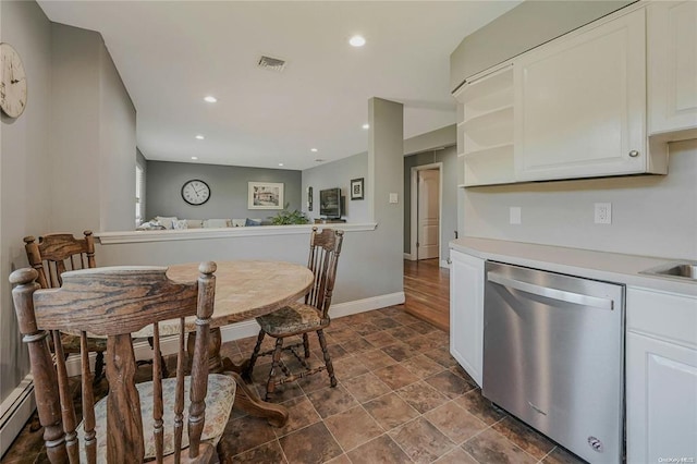 kitchen with white cabinets, visible vents, light countertops, and stainless steel dishwasher