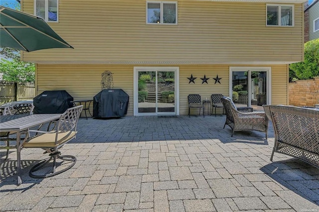 view of patio featuring fence and area for grilling