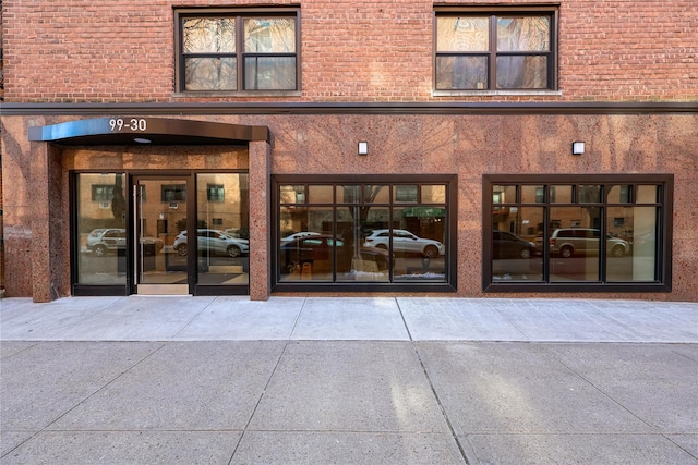 property entrance with brick siding