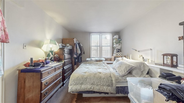 bedroom featuring dark colored carpet